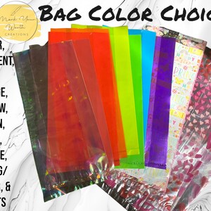 May include: Assortment of cellophane bags in various colors, including clear, iridescent, red, orange, yellow, green, blue, purple, spring/Easter, and hearts. The bags are arranged in a rainbow pattern.