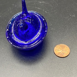 Tiny Cobalt Hen on a Nest