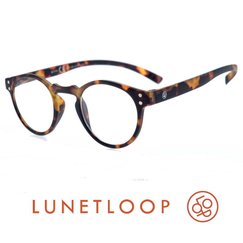 May include: Tortoiseshell pattern glasses with round frames and clear lenses. The temples feature a small circular logo on the side. Below the glasses, the text LUNETLOOP is printed in orange, accompanied by a circular orange logo with a loop design.