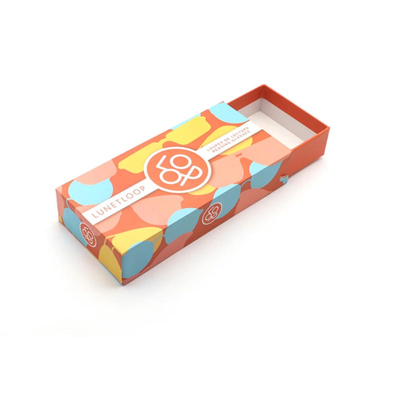 May include: A rectangular orange sliding box for reading glasses featuring a repeating pattern of stylized glasses in yellow, light blue, and peach. The top displays a white circular logo with the text LUNETLOOP and LOUPES DE LECTURE READING GLASSES.