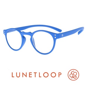 May include: Bright blue round-frame glasses with clear lenses. The frames feature a matte finish, a keyhole bridge, and two small silver-tone rivets on each side. The temple arms are curved, and the text LUNETLOOP is visible below the glasses.