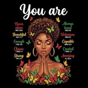 Può includere: Illustrazione di una donna nera in preghiera, circondata da farfalle colorate. Le parole "You are" sono in alto, con parole ispiratrici come "Beautiful", "Strong" e "Amazing" intorno all'immagine, su sfondo nero.