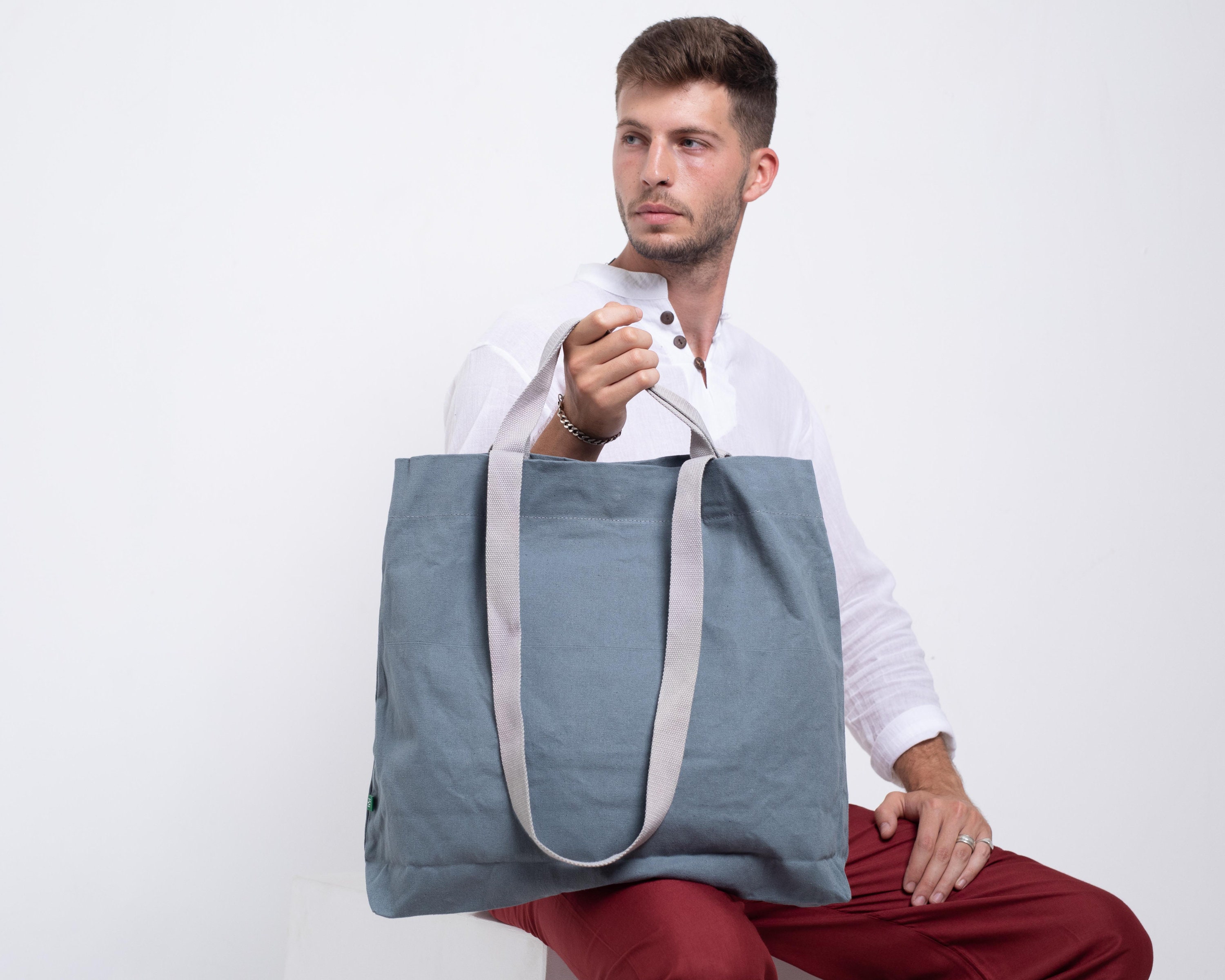 Why every real man carries a tote bag | Kyle Chayka | The Guardian