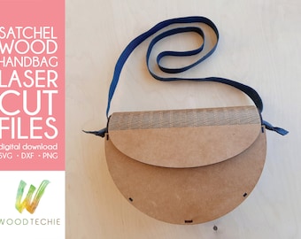 May include: A brown wooden satchel handbag with a blue strap. The bag has a flap that closes with a snap. The bag is made of laser cut wood and has a decorative pattern on the front. The text "SATCHEL WOOD HANDBAG LASER CUT FILES" is on the left side of the image. The text "digital download SVG - DXF - PNG" is below the first text. The text "WOODTECHIE" is in the lower left corner of the image.