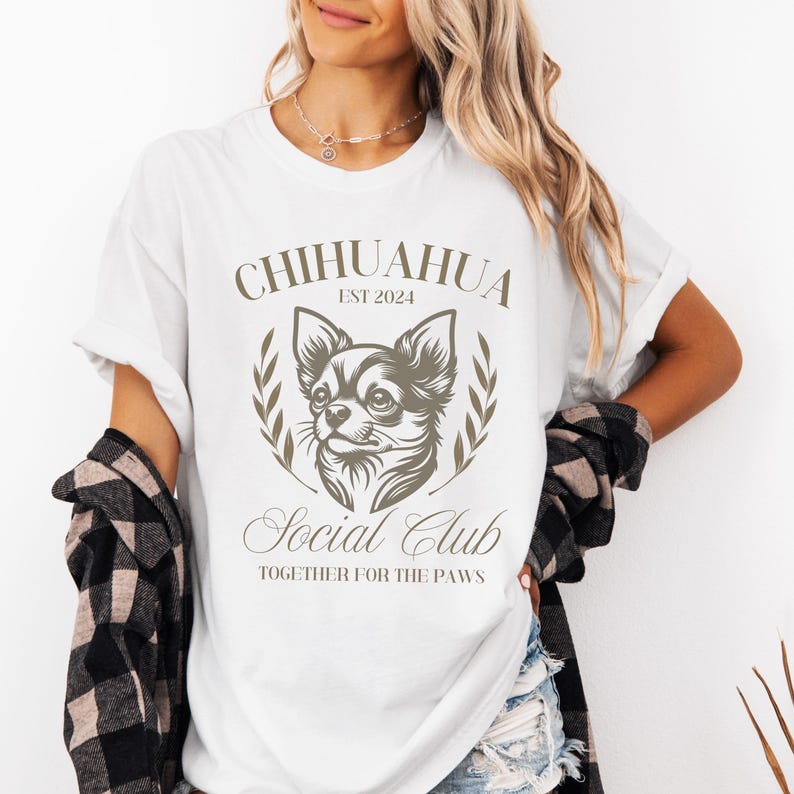 May include: White t-shirt with a brown graphic of a chihuahua and the text "Chihuahua Est 2024 Social Club Together for the Paws".