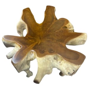 May include: A unique, handcrafted wooden table with a natural, organic shape. The table features a light-colored, textured base and a dark brown, smooth top. The overall design is reminiscent of a star or flower, making it a striking centerpiece. The table measures approximately 48 inches in diameter.