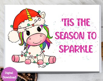 May include: A white unicorn with a rainbow mane and tail wearing a red Santa hat with a white trim and a string of colorful lights around its neck. The text "'Tis the season to sparkle" is written in pink letters on a white background.