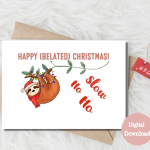 May include: A digital download card featuring a cartoon sloth hanging from a branch with Christmas lights. The text "HAPPY (BELATED) CHRISTMAS!" is at the top of the card. The text "Ho Ho Slow" is written in red below the sloth.