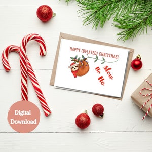May include: A digital download card featuring a cartoon sloth hanging from a branch with Christmas lights. The card reads "Happy (Belated) Christmas!" and "Slow Ho Ho".