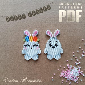 May include: Two white beaded bunny charms with colorful flower crowns. The bunnies are made with white and gray beads and have black eyes. The charms are on a brown background with a scattering of white and pink beads. The text "Happy Easter" and "Brick Stitch Patterns PDF" is at the top of the image.