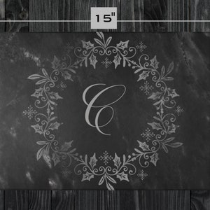 May include: Black slate serving tray with a silver-grey design of a holly wreath and snowflakes. The wreath encircles the letter "C". The tray measures 11 inches by 15 inches.