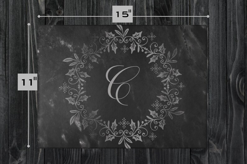 May include: Black slate serving tray with a silver-grey design of a holly wreath and snowflakes. The wreath encircles the letter "C". The tray measures 11 inches by 15 inches.