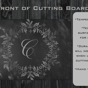 May include: A black cutting board with a white floral design and the letter "C" in the center. The board is made of tempered glass and has a textured surface. The text "FRONT OF CUTTING BOARD" is at the top of the image. The text "*TEMPERED GLASS", "*TEXTURED SURFACE IDEAL FOR CUTTING", "*DURABLE PRINT WILL NOT SCRATCH WHEN USED AS A CUTTING SURFACE", and "*HAND WASH ONLY" is on the right side of the image.