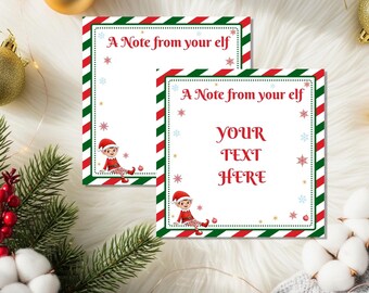 Puede incluir: Dos tarjetas rectangulares blancas con un borde a rayas rojas, verdes y blancas. Las tarjetas tienen el texto "A Note from your elf" y "YOUR TEXT HERE". Un elfo de dibujos animados está en la parte inferior de cada tarjeta.