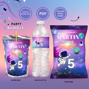 May include: A party bundle with a space theme featuring a Capri Sun juice pouch, a water bottle, and a chip bag. Each item has a label with a cartoon astronaut, planets, and the text "Let's Have Blast! Martin Turns 5".