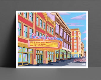 May include: A colorful illustration of a vintage movie theater called "Englewood" with a marquee listing upcoming shows: "Mar 21 One Doozy Brothers", "12 John Green", "Apr 2-5 Mission Creek".