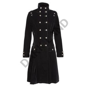 May include: A black velvet coat with a high collar and a double row of silver buttons. The coat has a fitted waist and a flared skirt.
