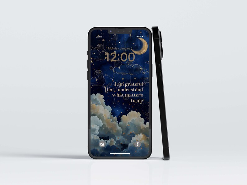 May include: Black smartphone featuring a night sky wallpaper with clouds, stars, and a crescent moon. The screen shows the time and the text: "I am grateful that I understand what matters to me."