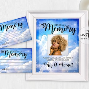 May include: A framed memorial sign and matching cards. The sign features a photo of a woman with curly hair, the text "Share a Memory," and the words "Please take a card and share a memory of our beloved." The cards have the same text.