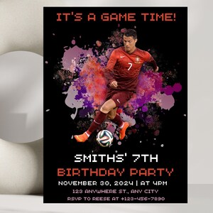 May include: A black and red birthday party invitation with a soccer player in a red and white jersey kicking a soccer ball. The text on the invitation reads "It's a game time!" and "Smith's 7th Birthday Party".