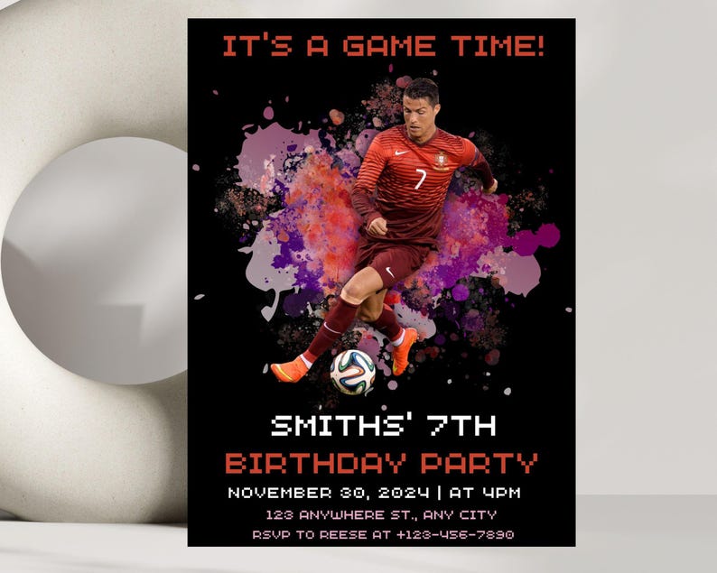May include: A black and red birthday party invitation with a soccer player in a red and white jersey kicking a soccer ball. The text on the invitation reads "It's a game time!" and "Smith's 7th Birthday Party".