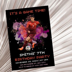 May include: A birthday party invitation with a soccer theme. It features a photo of a soccer player in a red jersey with a soccer ball. The text on the invitation reads "It's a game time!" and "Smith's 7th Birthday Party".