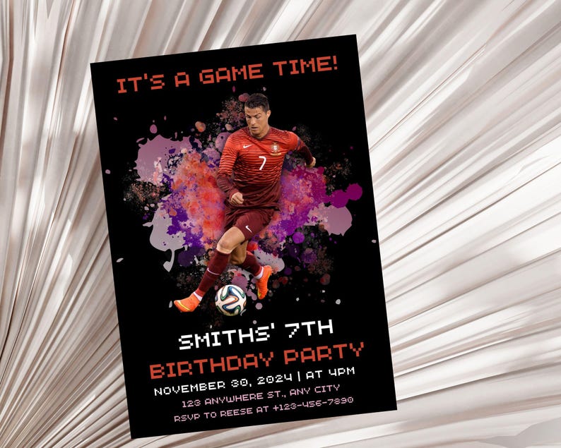 May include: A birthday party invitation with a soccer theme. It features a photo of a soccer player in a red jersey with a soccer ball. The text on the invitation reads "It's a game time!" and "Smith's 7th Birthday Party".