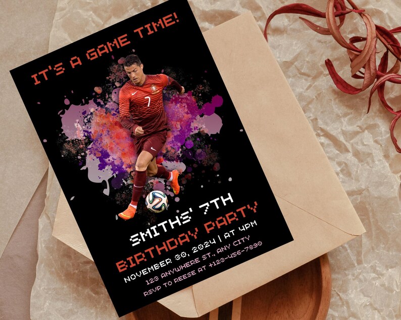 May include: A black and red birthday party invitation with a soccer player in a red and white jersey. The invitation says "It's a game time!" and "Smith's 7th Birthday Party".