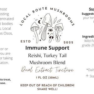 May include: A black and white illustration of mushrooms with a moon and stars. The text "Local Route Mushrooms" is in a circle around the mushrooms. The text "Immune Support" is below the circle. The text "Reishi, Turkey Tail Mushroom Blend Dual Extract Tincture" is below the text "Immune Support". The text "1 FL OZ (30ML)" is below the text "Dual Extract Tincture". The text "Keep out of reach of children! Shake well!" is below the text "1 FL OZ (30ML)". The text "Supplement Facts" is in the top right corner of the image. The text "Suggested use: 1-3 droppers* on your tongue or in your preferred beverage per day +" is below the text "Supplement Facts". The text "Ingredients: Reishi Fruit bodies*, Wild Foraged Turkey Tail*, food grade 200 proof ethanol*, distilled water*" is below the text "Suggested use: 1-3 droppers* on your tongue or in your preferred beverage per day +". The text "*Daily values are not established. + Statements not evaluated by the FDA." is below the text "Ingredients: Reishi Fruit bodies*, Wild Foraged Turkey Tail*, food grade 200 proof ethanol*, distilled water*".