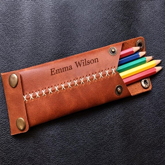 Genuinely handcrafted leather roll at a premium price point — the kind of bespoke desk/travel organizer a serious maker or artist commissions once and keeps for decades.