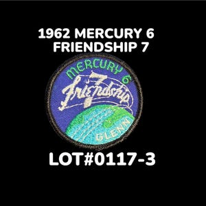 May include: Embroidered patch with the text "1962 MERCURY 6 FRIENDSHIP 7" and "LOT#0117-3". The patch features a blue and green globe with the words "MERCURY 6 Friendship" in white and green lettering.
