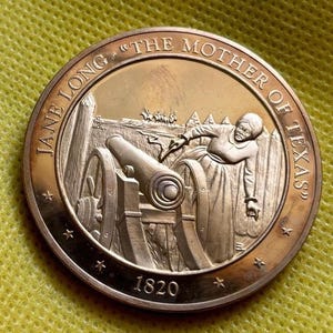May include: A bronze medal with a portrait of Jane Long, "The Mother of Texas", and a cannon. The medal is dated 1820.