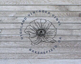 May include: Black and white logo on a wood background. The logo features a stylized flower and the text "HIGHLAND VINTAGE & VINYL BAKERSFIELD, CA."