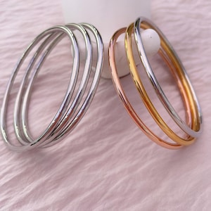 Set di 3 bracciali rigidi in acciaio inossidabile, impermeabili e impilabili, gioielli moderni e minimalisti.