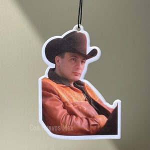 May include: A brown leather jacket with a cowboy hat and the text "Con Huevos Mex" on the bottom.