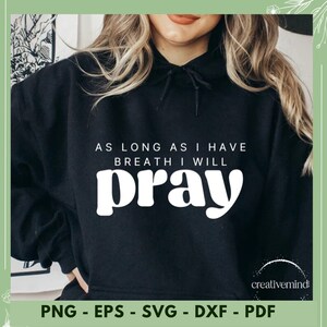 May include: Black hoodie with white text that reads "As long as I have breath I will pray".