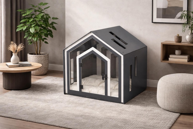 May include: A dark gray pet house with a white-trimmed gabled roof and a matching white-trimmed front door. The structure features vertical rectangular cutouts on the side and a plush, tufted white cushion inside for comfort and rest.