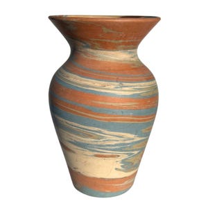 May include: A small, ceramic vase with a marbled design in shades of blue, orange, and white.
