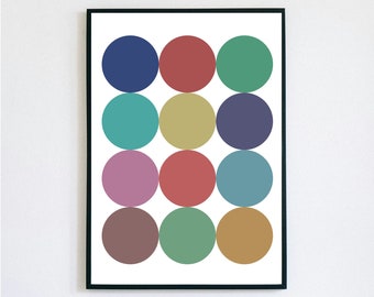 Könnte beinhalten: Ein gerahmter Kunstdruck mit einem Muster aus zwölf farbigen Kreisen. Die Kreise sind in einem Raster von drei Reihen zu je vier angeordnet, mit Farben wie Blau, Rot, Grün und Gelb. Das Kunstwerk ist in einem schwarzen Rahmen.