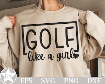 以下が含まれることがあります： 黒い文字で「GOLF like a girl」と書かれたベージュのスウェットシャツ。黒い長方形で囲まれています。「girl」の横には小さなハートのグラフィックがあります。スウェットシャツは長袖で、クルーネックです。