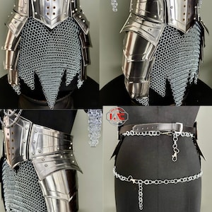 May include: A set of medieval-style armor pieces, including gauntlets, shoulder armor, and a belt with chain accents. The armor is made of shiny, silver-colored metal and chainmail. The belt is black leather with a silver chain.
