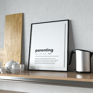 May include: A black framed poster with the word "parenting" defined as "Similar to insanity, parenting is the act of turning your life upside down and wondering whether you may be able to sit down and watch another Netflix series ever again."