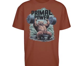 May include: A brown t-shirt with a graphic of a bear lifting weights. The text "PRIMAL POWER" is printed on the shirt.