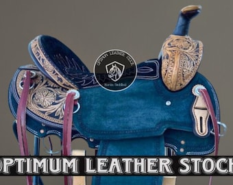 May include: A dark blue leather saddle with brown and gold tooling. The saddle is on a black metal stand. The saddle is labeled "Optimum Leather Stock" and "Horse Saddles".