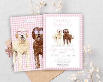 May include: A set of pink gingham-patterned birthday invitations. The invitations feature watercolor illustrations of two dogs wearing glasses. The text reads "Turning One & Doodles of Fun" and includes event details.