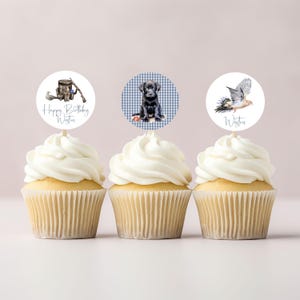 May include: Three cupcakes with personalized toppers. The toppers feature a dog, a bird, and a tree stump. The cupcakes are frosted with white frosting and have a blue and white checkered background.