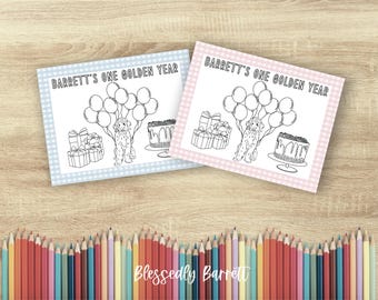 May include: Two coloring pages with the text "Barrett's One Golden Year" are displayed. The pages feature a dog, balloons, gifts, and a cake. One page has a blue gingham border, and the other has a pink gingham border. A row of colored pencils is at the bottom.
