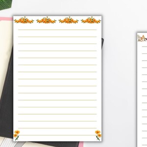 May include: Two printable lined sheets of paper with floral borders. The top sheet has a border of orange flowers and the bottom sheet has a border of red, orange, and yellow flowers.