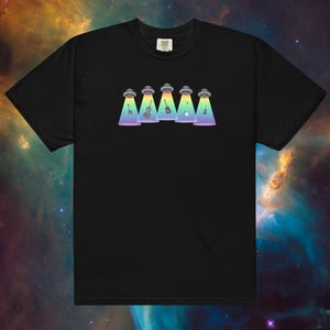 May include: Black t-shirt with a graphic of five UFOs hovering over musical instruments, including a guitar, banjo, violin, and mandolin. The UFOs are emitting rainbow beams of light.