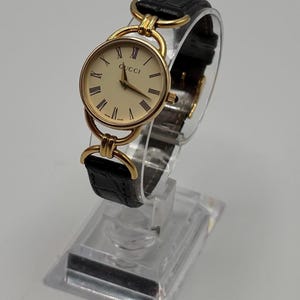 Vintage 1980s 1990s GUCCI 6000L Gold Plated Quartz Watch Black Leather Strap Roman Dial Authentic *Ref 12